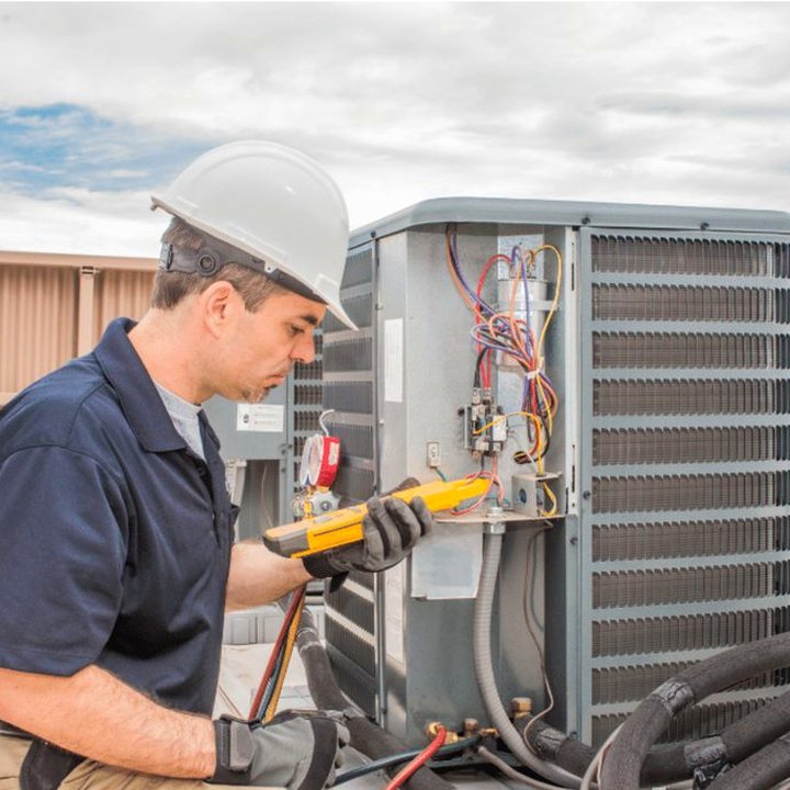 Wyoming Heating & Cooling HVAC technician on a service call in Wyoming, Ontario